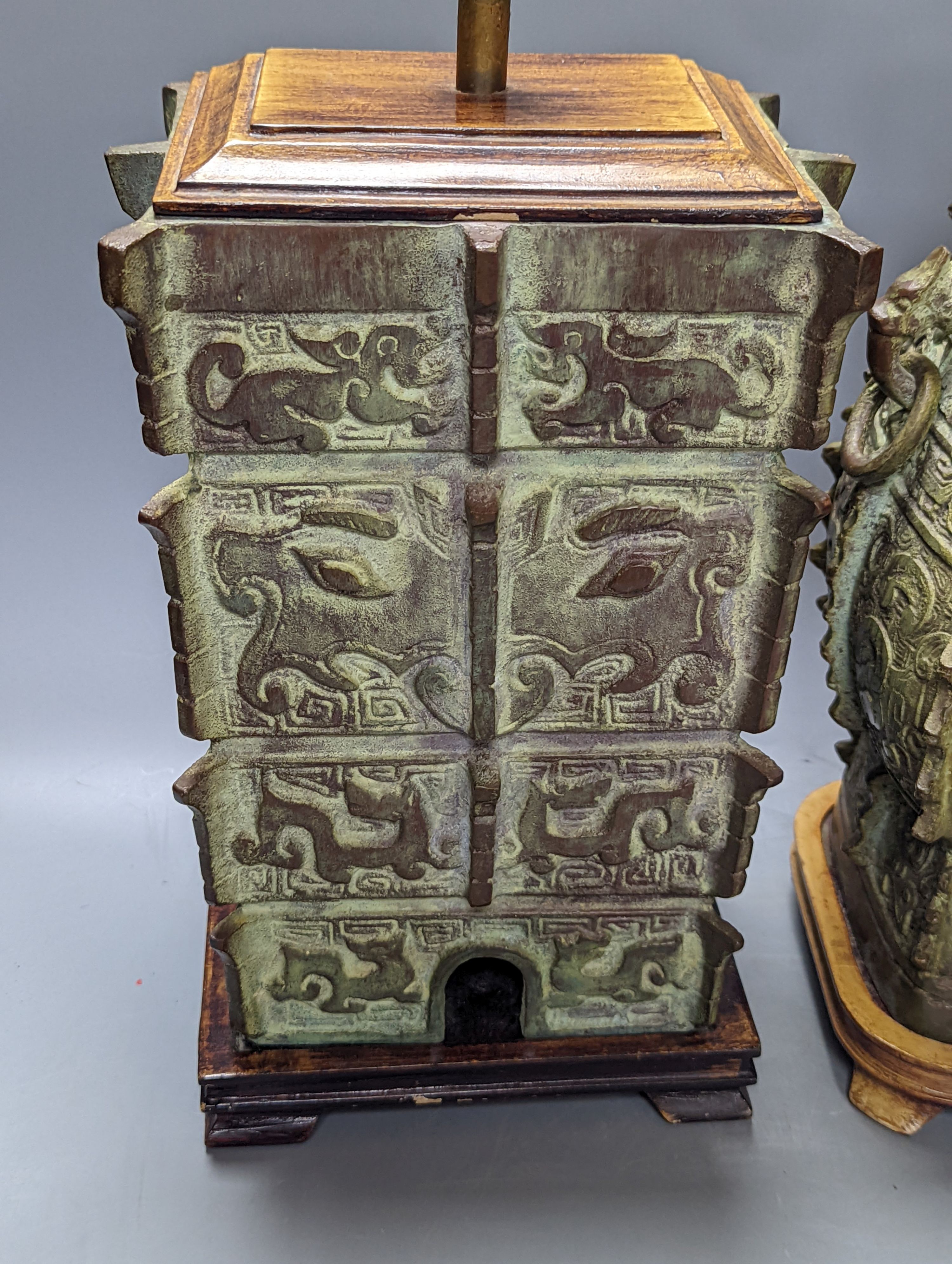 Two Chinese archaic style bronze lamp bases, 38 cm high to top of fitting